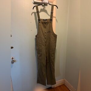 J. Peterman Company olive green cotton twill bib overalls.